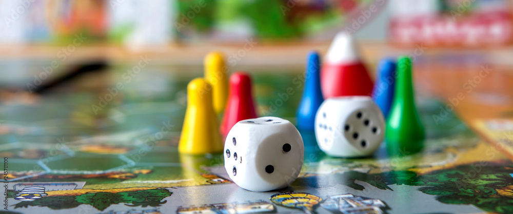 concept of board games. Dice, chips and cards on a green background long banner